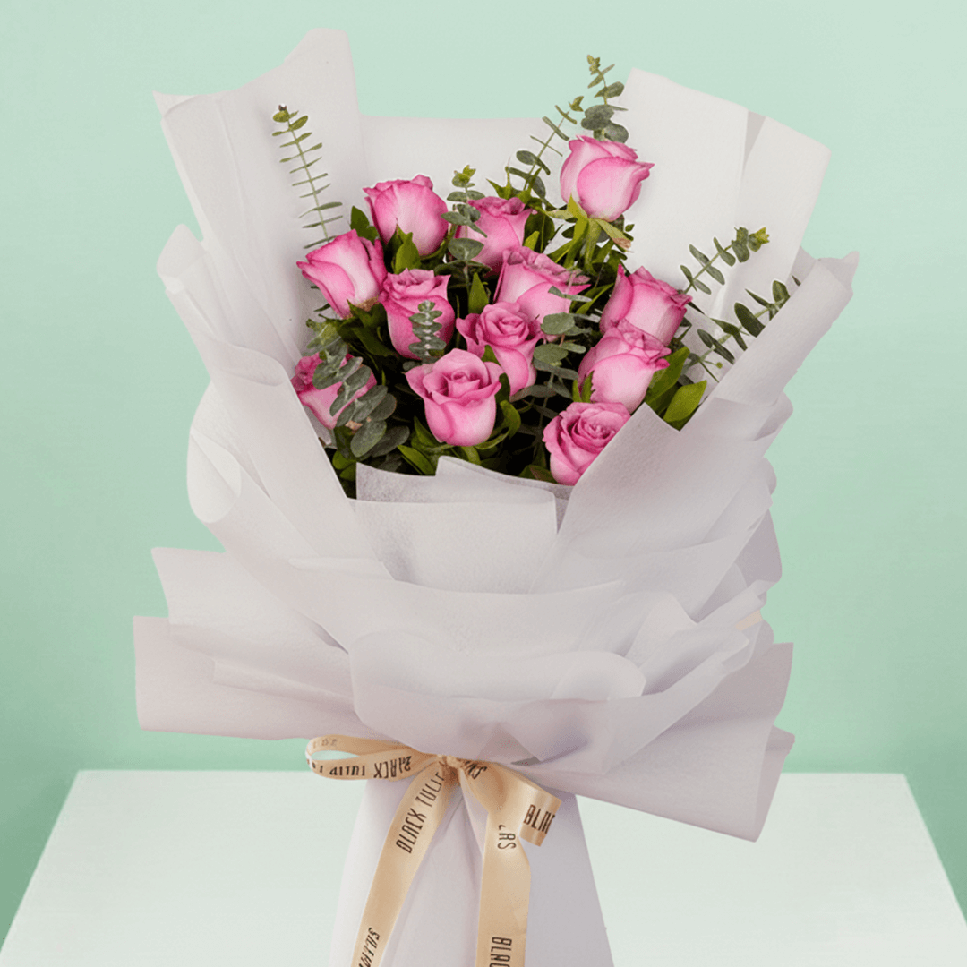 Purple Roses Bouquet arranged with 12 purple roses and eucalyptus