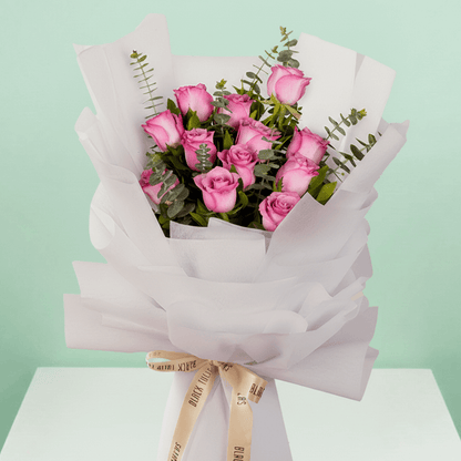 Purple Roses Bouquet arranged with 12 purple roses and eucalyptus
