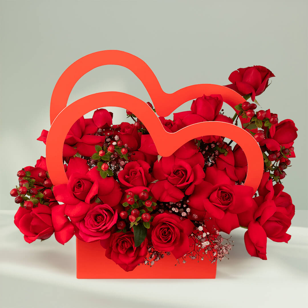 Red roses arranged in a heart-shaped flower box