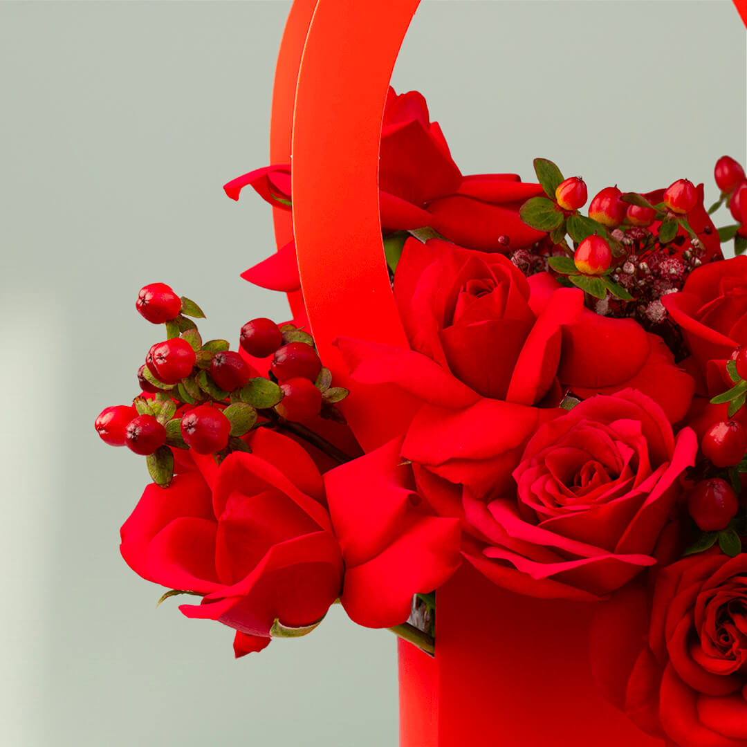 Red roses arranged in a heart-shaped flower box
