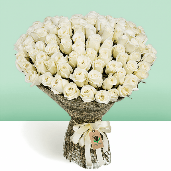 Bouquet of 50 white roses wrapped in natural jute and finished with an ivory ribbon