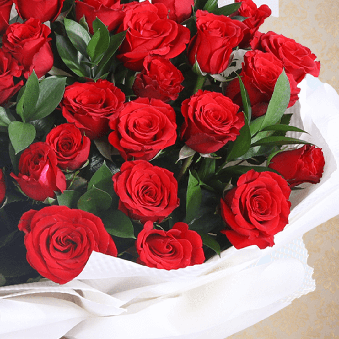 Premium red roses bouquet in a elegant white wrap.