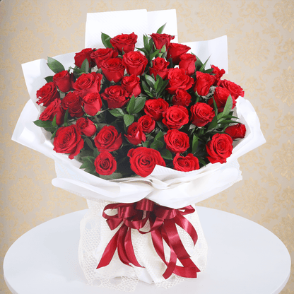 Premium red roses bouquet in a elegant white wrap.
