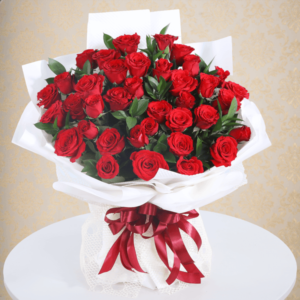 Premium red roses bouquet in a elegant white wrap.