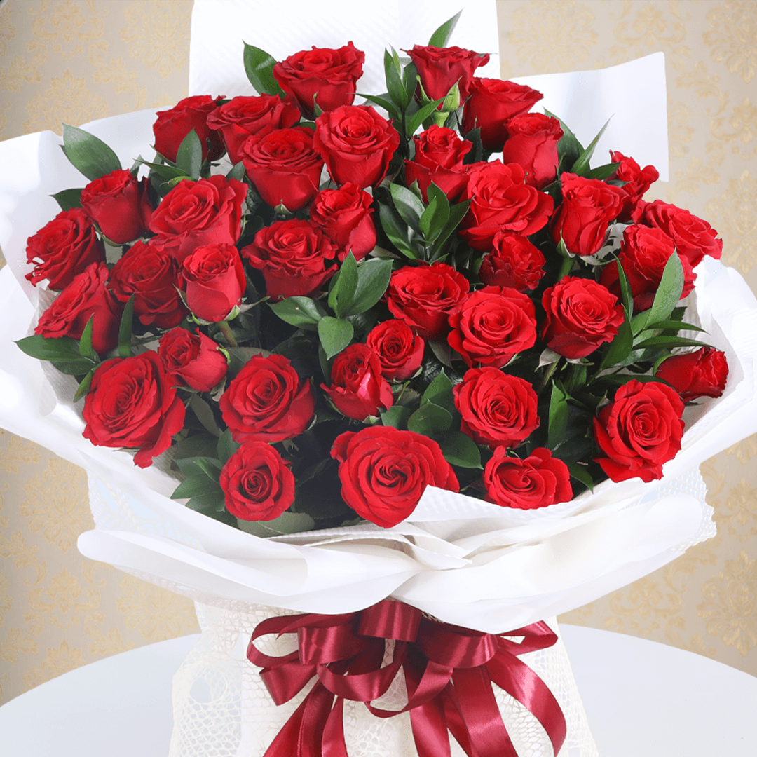 Premium red roses bouquet in a elegant white wrap.