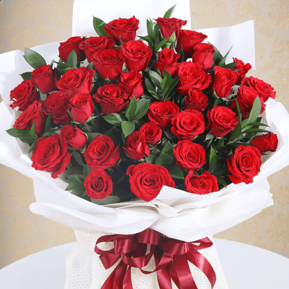 Premium red roses bouquet in a elegant white wrap.
