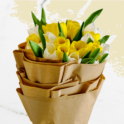 Bouquet of 20 white and yellow tulips wrapped in brown non-woven paper