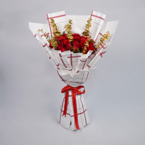 Bouquet of 26 red Roses with Eucalyptus in red and gold Korean-style wrapping.