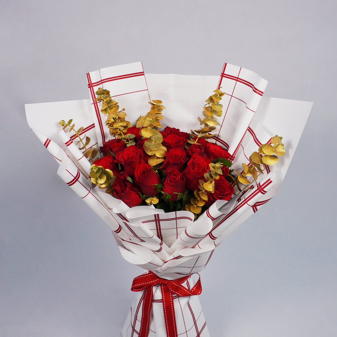 Bouquet of 26 red Roses with Eucalyptus in red and gold Korean-style wrapping.