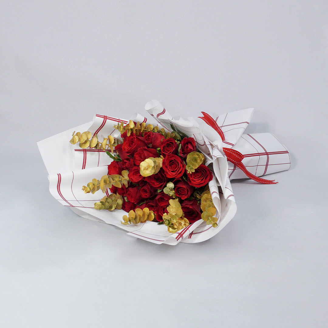 Bouquet of 26 red Roses with Eucalyptus in red and gold Korean-style wrapping.