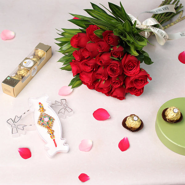 Bouquet of red Roses with greenery, one Meenakari Rakhi and four Ferrero Rocher chocolates.
