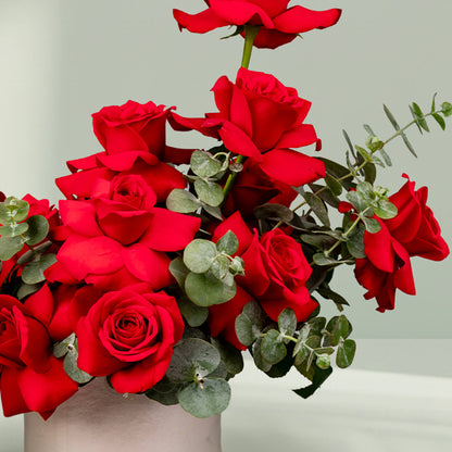 Scarlet Rose Eucalyptus Flower Box – elegant red roses with fresh eucalyptus arranged in a gift box.