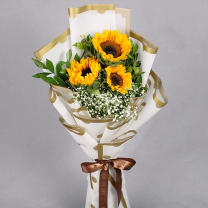 Sunflower bouquet with one Rakhi and a box of 16 Ferrero Rocher chocolates.