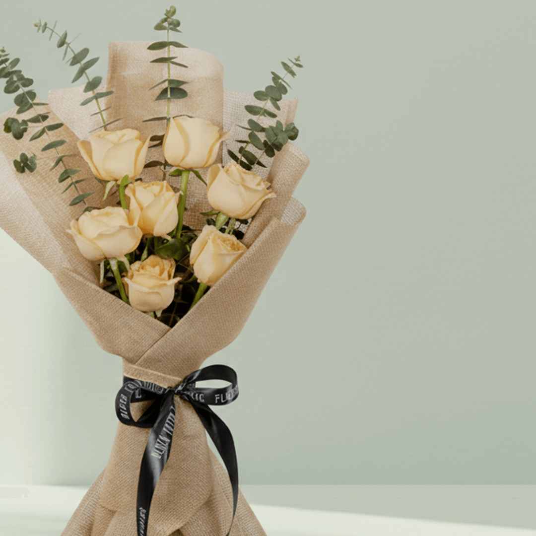 6 peach roses bouquet with eucalyptus in green wrapping