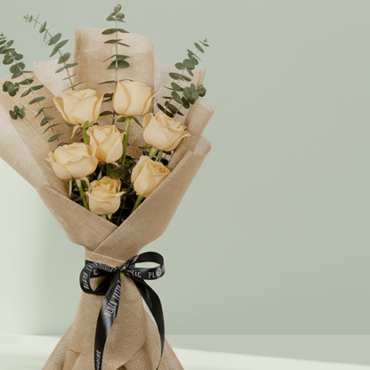 6 peach roses bouquet with eucalyptus in green wrapping