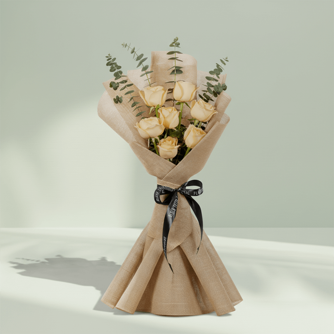 6 peach roses bouquet with eucalyptus in green wrapping