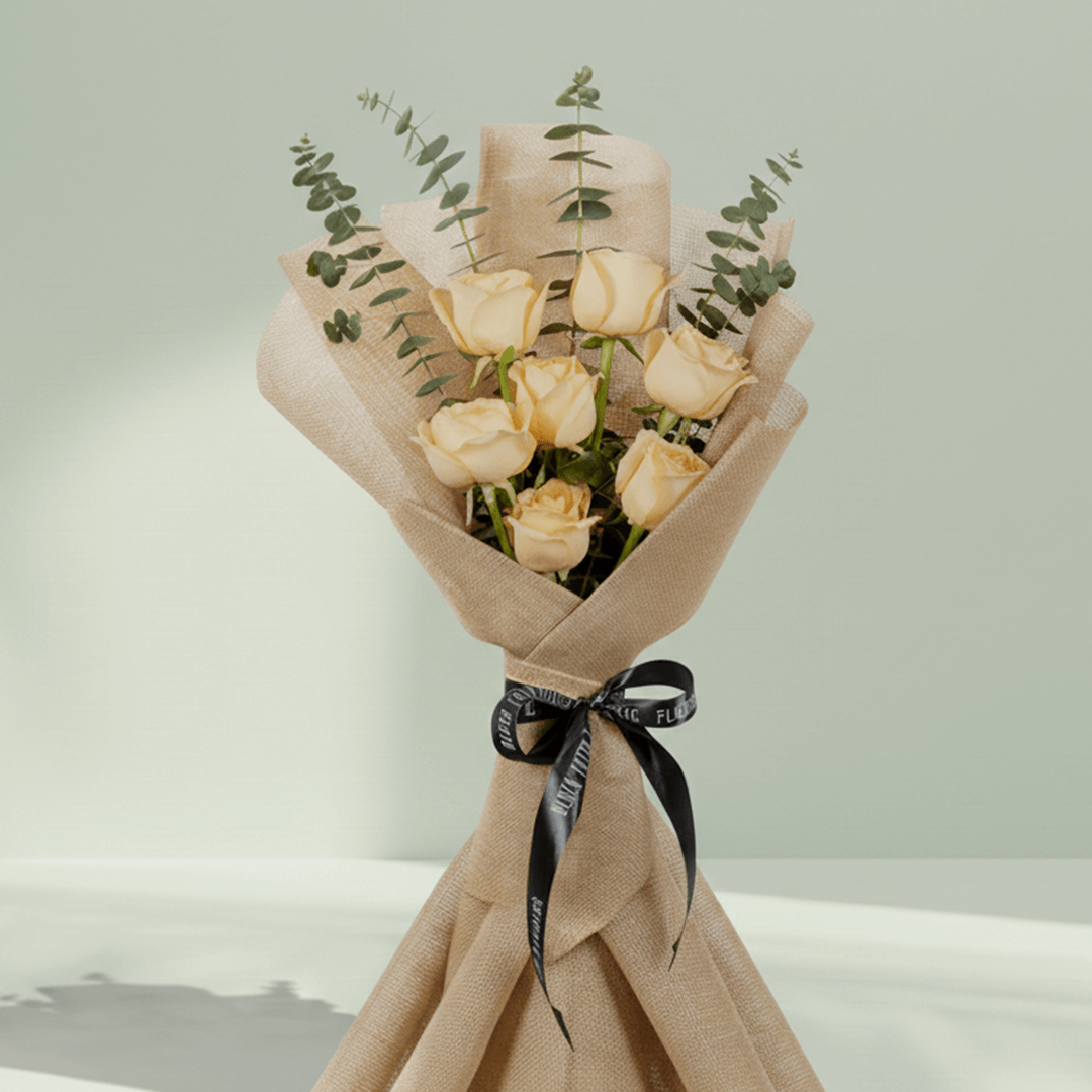 6 peach roses bouquet with eucalyptus in green wrapping
