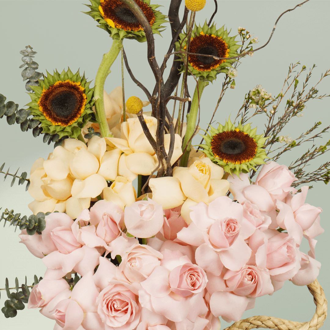Sunflower and pink rose vase arrangement with crisped wax flowers and curly Salix