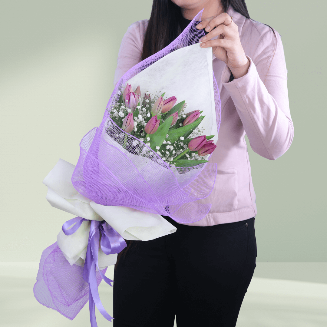 Bouquet of 10 fresh purple tulips beautifully arranged with delicate fillers