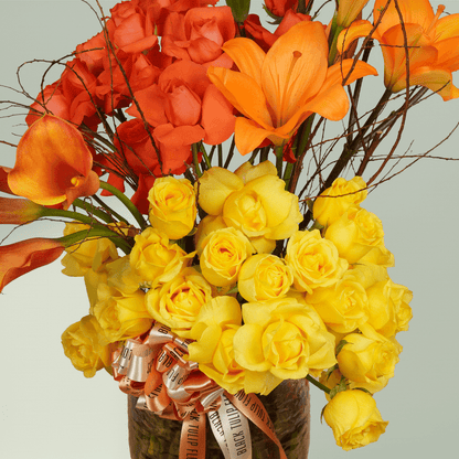 Saffron Surge calla lily rose vase with lilies and fillers in premium glass vase
