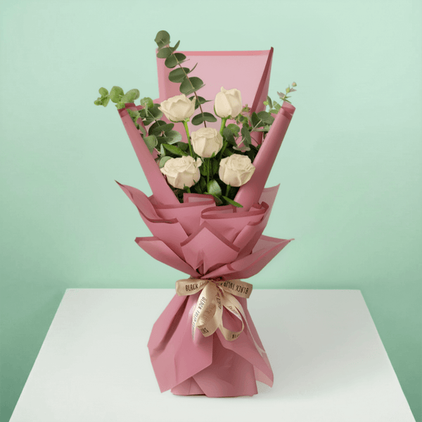 5 white roses bouquet with eucalyptus in Korean-style wrapping
