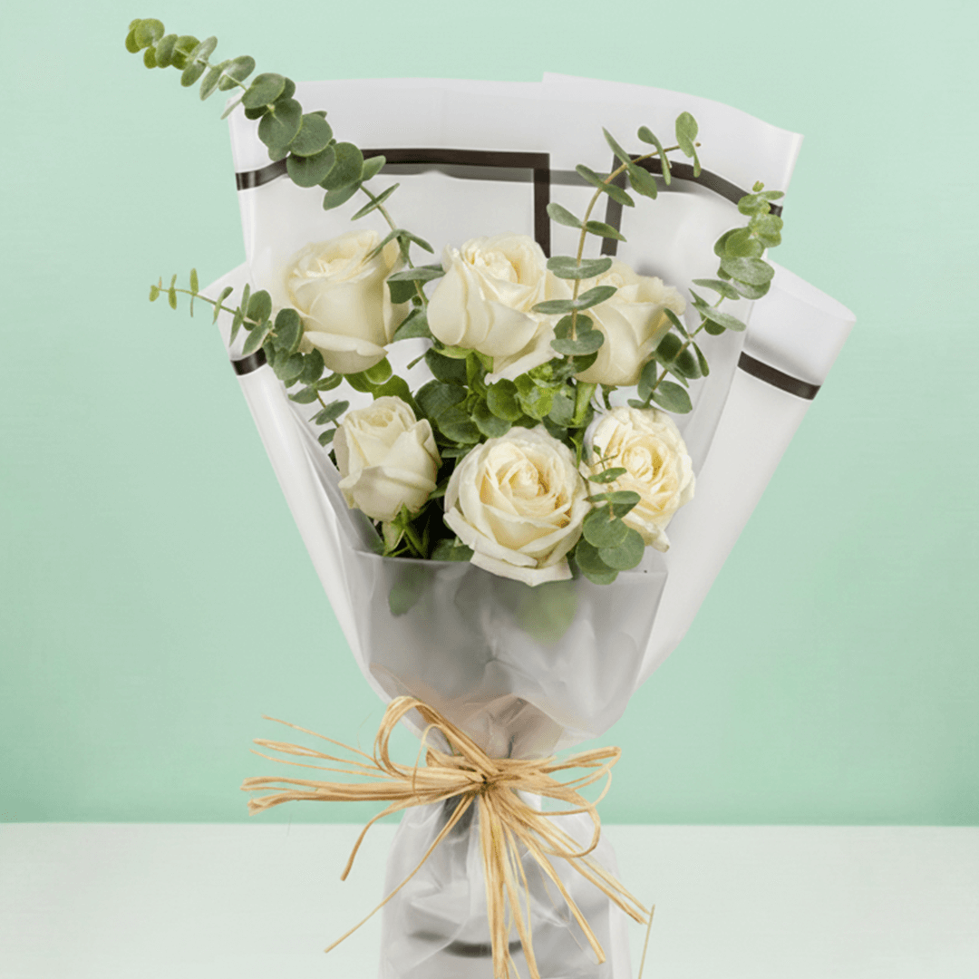 6 white roses bouquet with eucalyptus in Korean-style wrapping