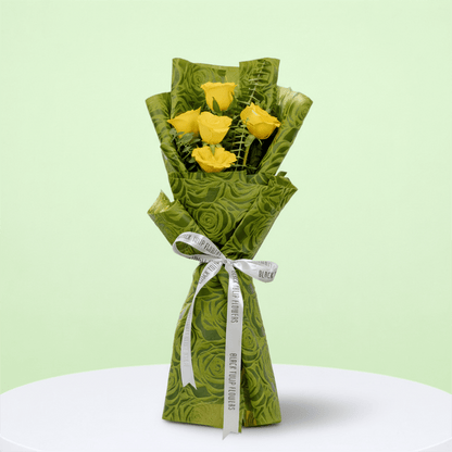 5 yellow roses bouquet with eucalyptus in green wrapping
