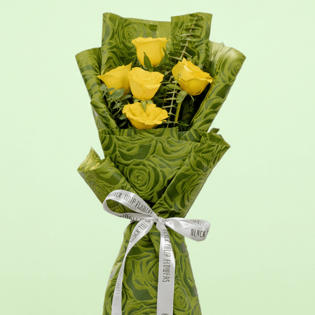 5 yellow roses bouquet with eucalyptus in green wrapping