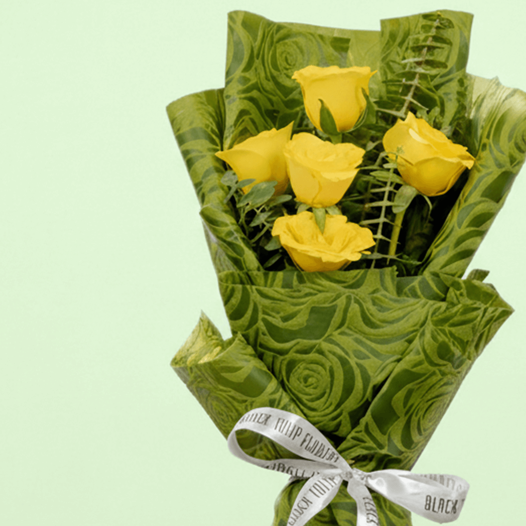 5 yellow roses bouquet with eucalyptus in green wrapping