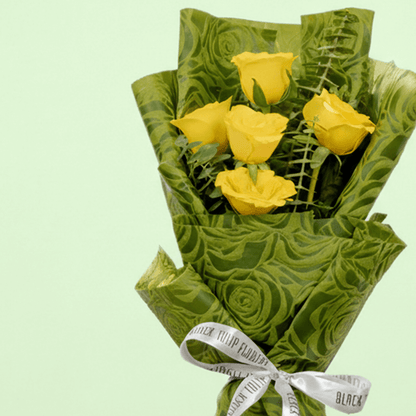 5 yellow roses bouquet with eucalyptus in green wrapping