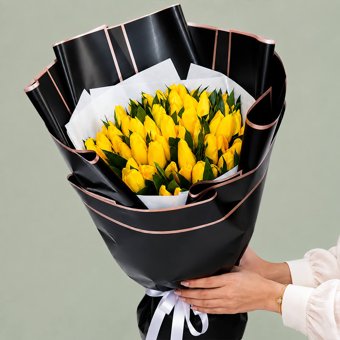 Yellow tulip hand bouquet for gifting and special occasions.