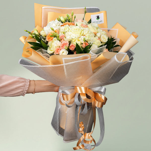 Exotic mixed flower bouquet with roses, Eustoma and spray roses in Korean wrapping