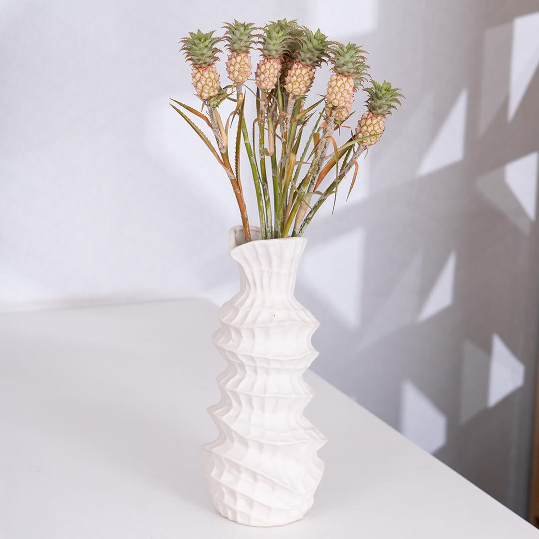 Fresh Ananas cut flowers wrapped in a brown sheet