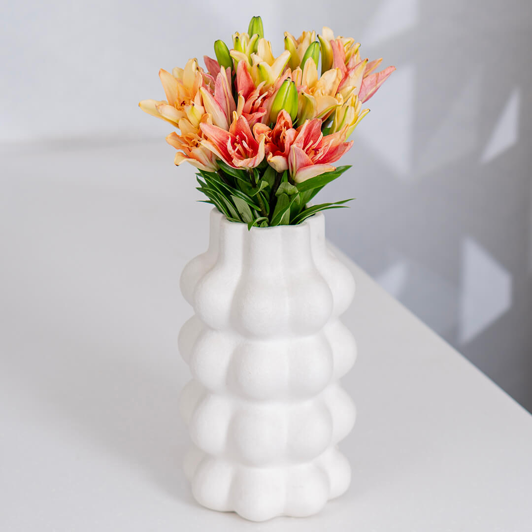 Asiatic lily flowers with broad petals and large open blooms arranged as fresh cut stems