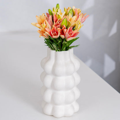 Asiatic lily flowers with broad petals and large open blooms arranged as fresh cut stems