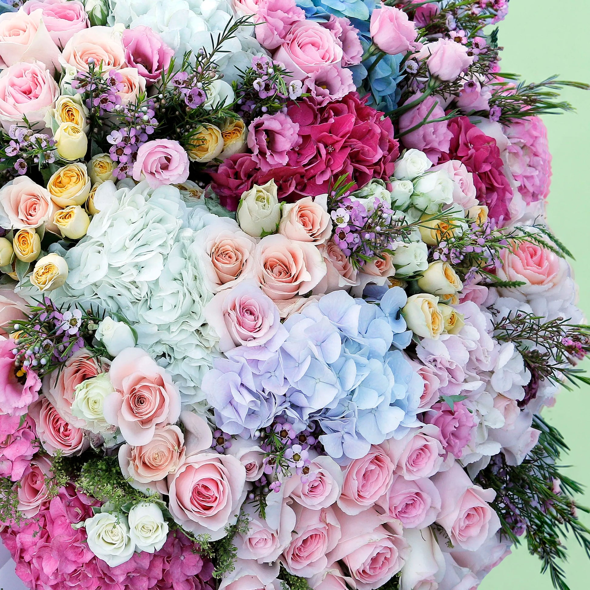 Assorted fresh floral wrap bouquet with seasonal blooms and elegant wrapping