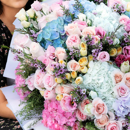 Assorted fresh floral wrap bouquet with seasonal blooms and elegant wrapping