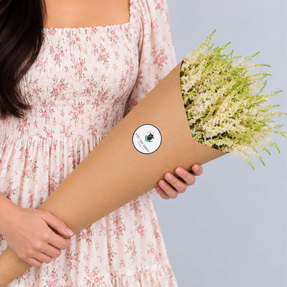 Fresh Astilbe cut flowers neatly arranged in brown paper wrapping