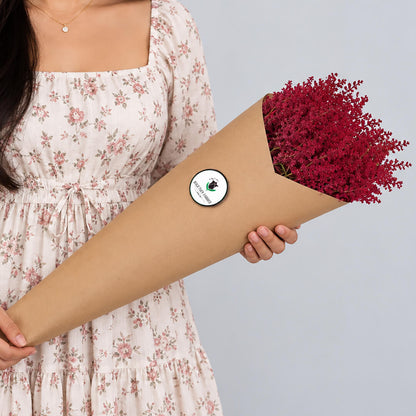 Fresh Astilbe cut flowers neatly arranged in brown paper wrapping