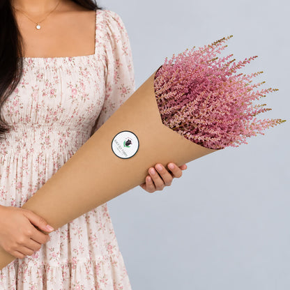 Fresh Astilbe cut flowers neatly arranged in brown paper wrapping