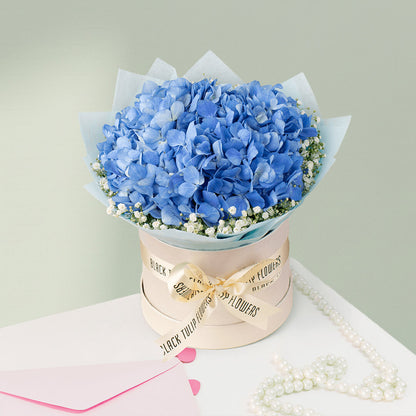 Blue Hydrangea and white Gypsophila flower box arrangement for elegant special occasion gifting