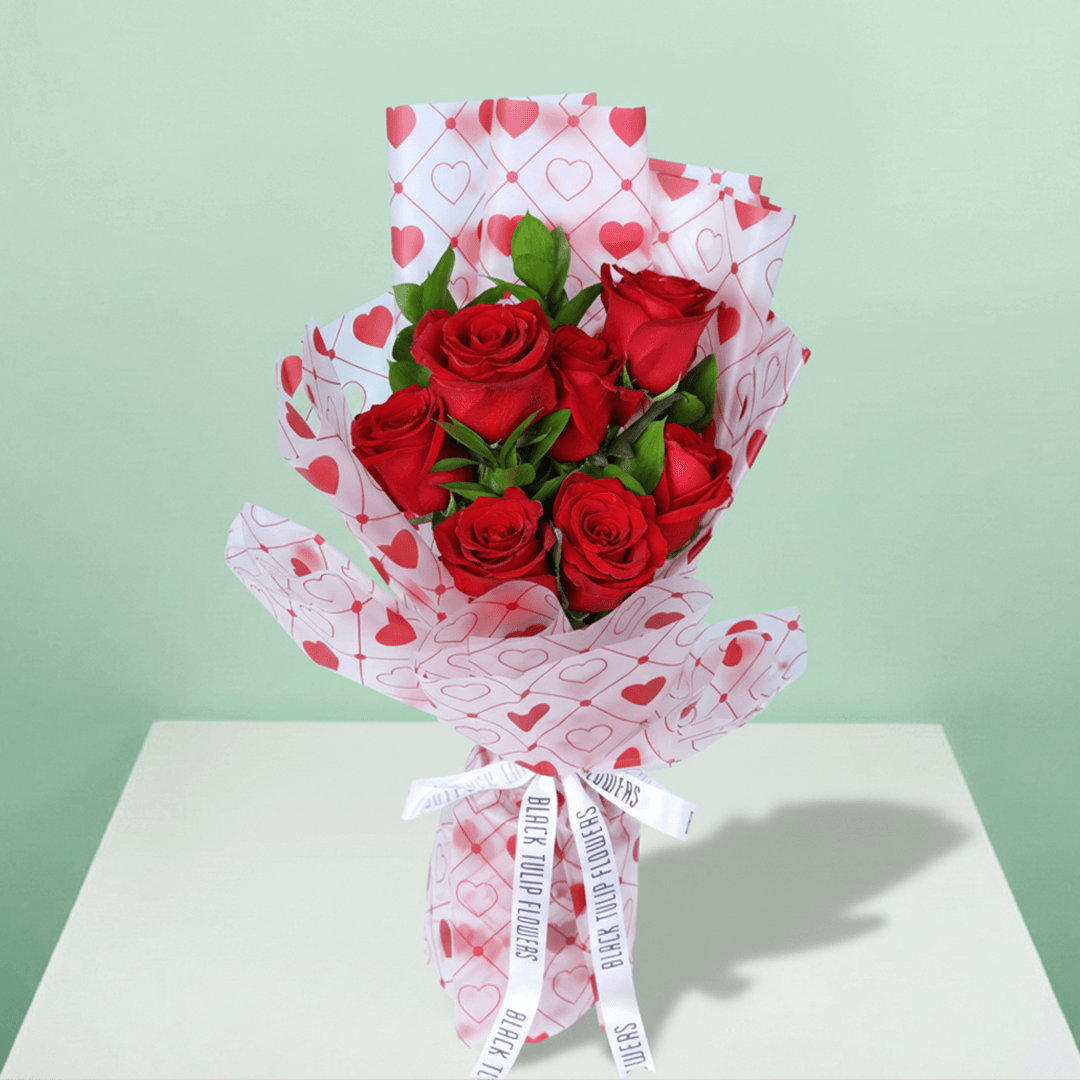 Blush Love 7 Red Rose Bouquet arranged with 7 red roses with fresh greenery