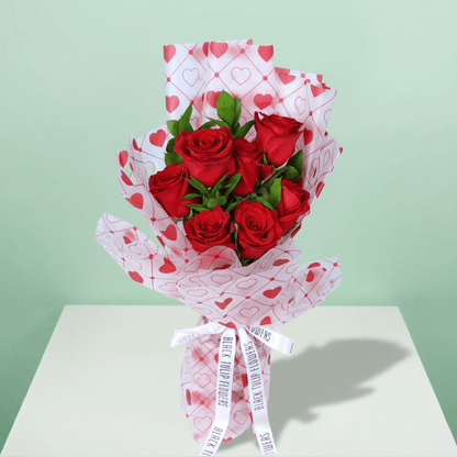 Blush Love 7 Red Rose Bouquet arranged with 7 red roses with fresh greenery