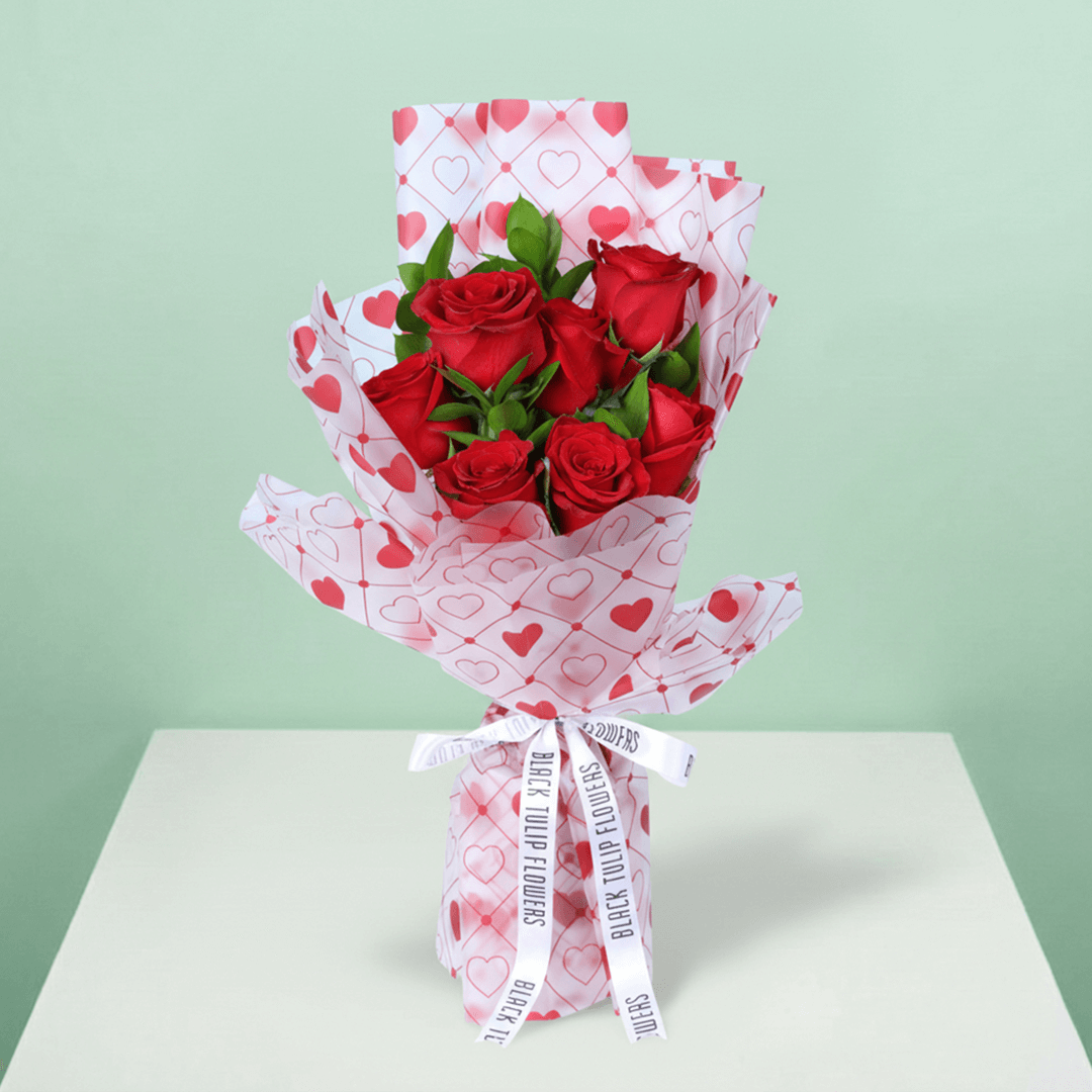 Blush Love 7 Red Rose Bouquet arranged with 7 red roses with fresh greenery