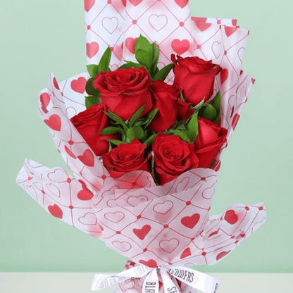 Blush Love 7 Red Rose Bouquet arranged with 7 red roses with fresh greenery
