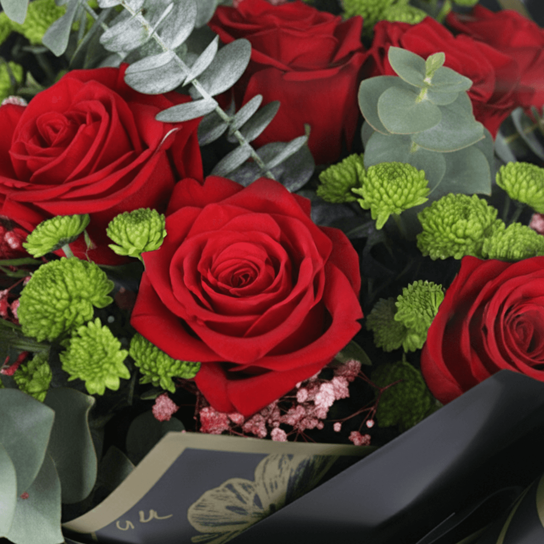 Ruby Charm Mixed Valentine Bouquet arranged with mixed fresh blooms in rich red tones