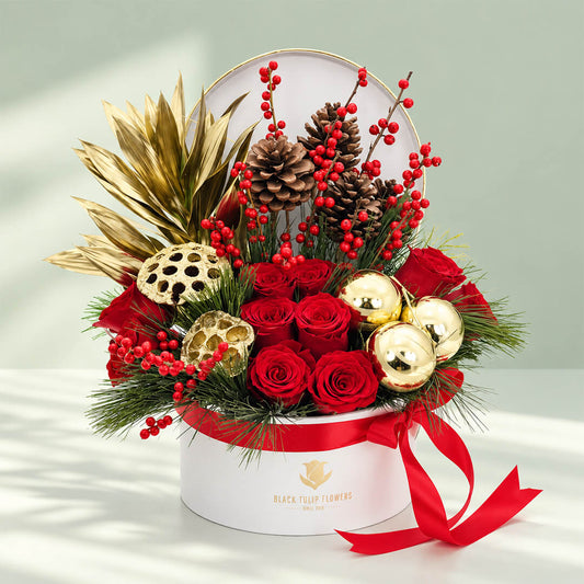 Christmas floral gift box featuring 25 to 30 assorted colorful flower stems arranged beautifully in a round box