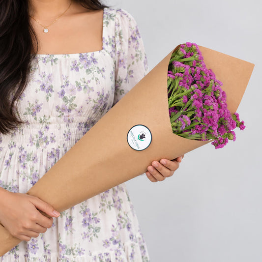Statice blooms carefully arranged in brown paper wrapping