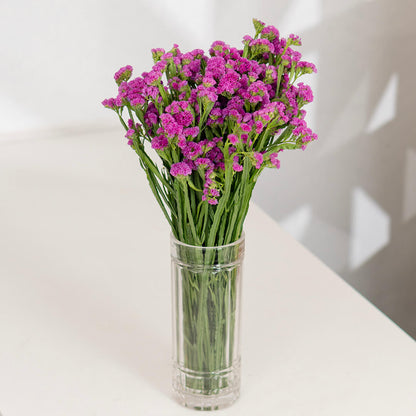 Statice blooms carefully arranged in brown paper wrapping