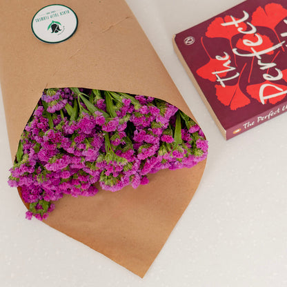 Statice blooms carefully arranged in brown paper wrapping